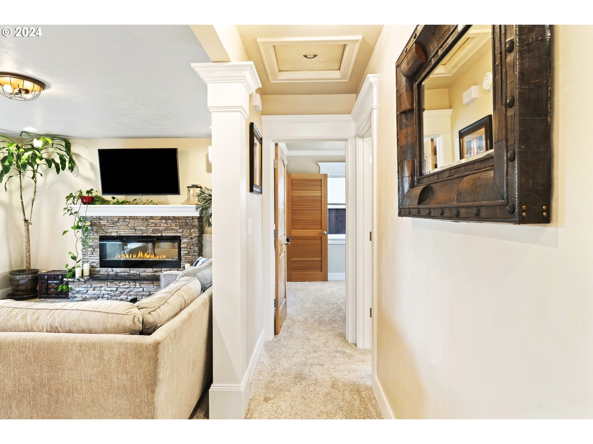 599 River Loop 2 Eugene, OR 97404 - Photo 14 of 25 a living room with furniture a flat screen tv and a fireplace