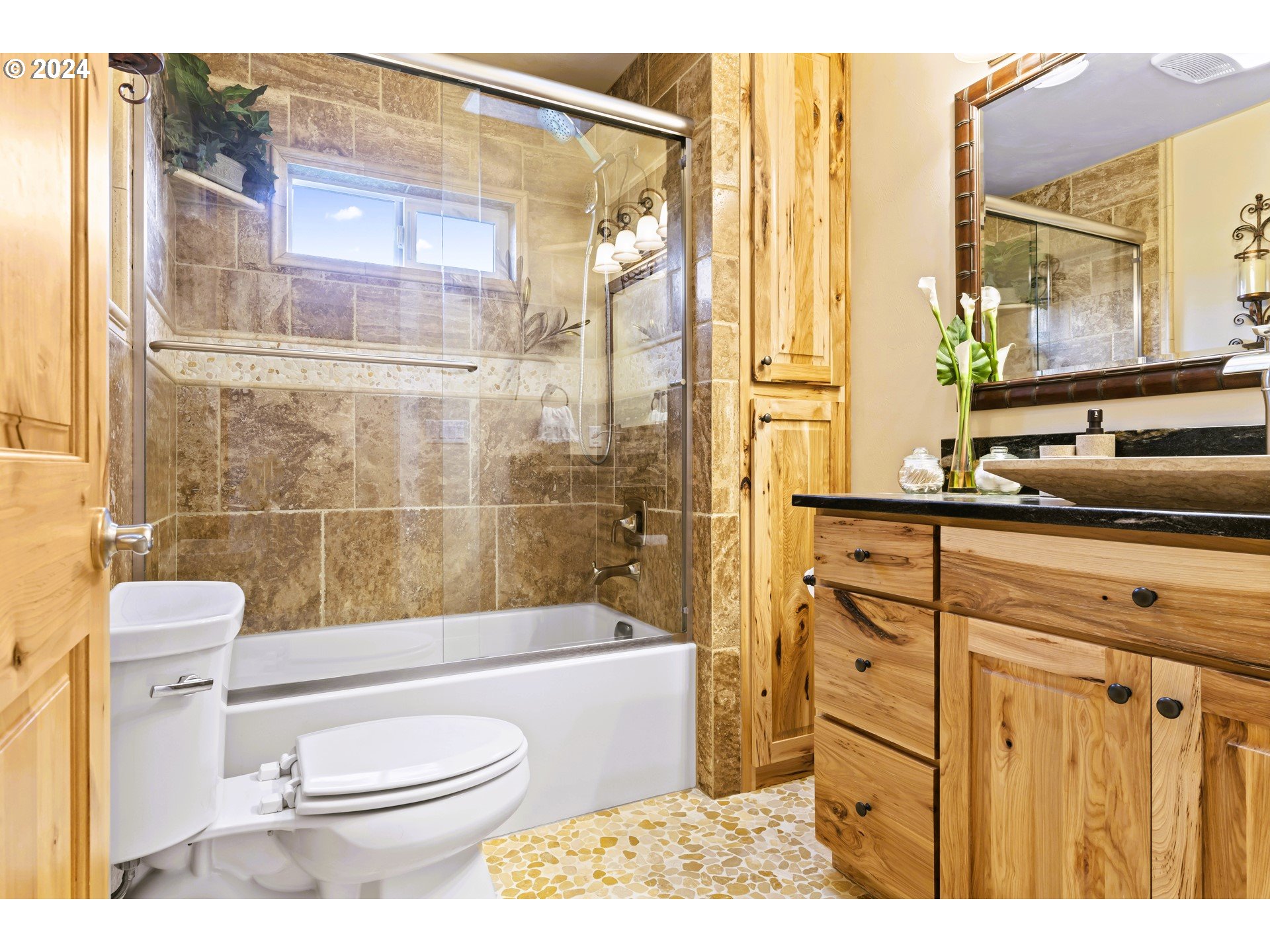 599 River Loop 2 Eugene, OR 97404 - Photo 17 of 25 a bathroom with a sink a toilet and shower
