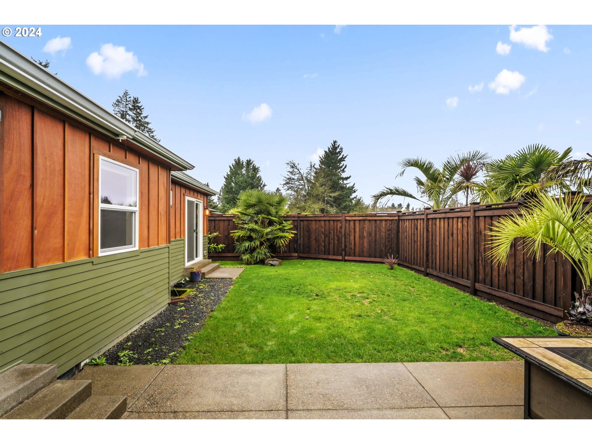 599 River Loop 2 Eugene, OR 97404 - Photo 21 of 25 a view of backyard with potted plants and wooden fence