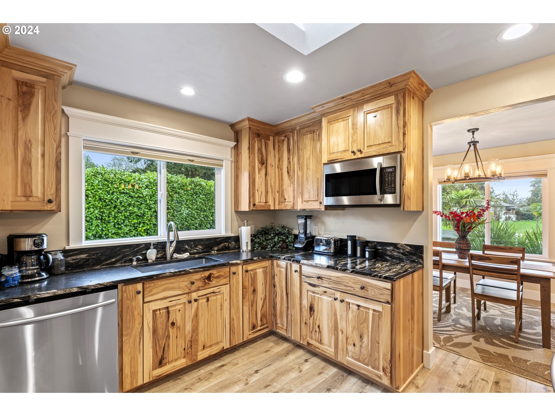 599 River Loop 2 Eugene, OR 97404 - Photo 10 of 25 a kitchen with sink a microwave and cabinets