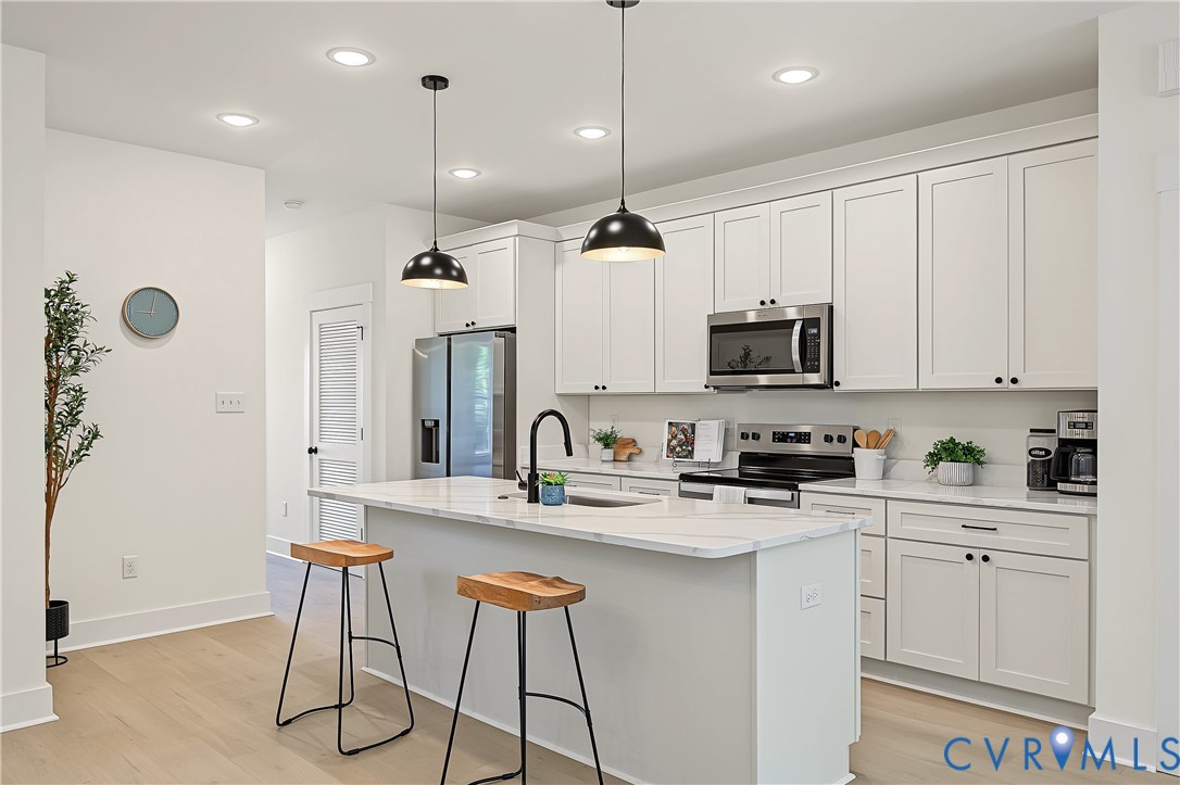3601.5 Decatur Street Richmond, VA 23224 - Photo 11 of 32 Light wood-finish flooring, white cabinetry with b