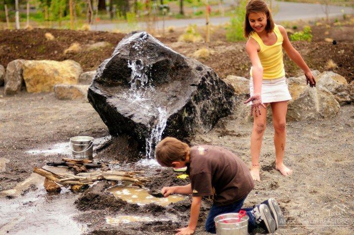 56221 Sable Rock Loop Bend, OR 97707 - Photo 12 of 12 Discovery Park Playground and Sport Courts - With outdoor play areas for the whole family,
everyone can enjoy their favorite pastimes. Do your little ones love to climb, swing, dig and
experiment? Discovery Park is the perfect place for their imaginations to blosom. Situated next to
the Quarry Pool and Fitness Center and overlooking Obsidian Lake, it is a beautiful place to play.
Discovery Park is a unique combination of learning and playing. The park features life sized
musical instruments, a climbing rock for daring little climbers, an interactive stream and waterway
system, just perfect for building and exploring with nature, and high-flying swings.
You can also enjoy the sport courts for tennis, pickle ball, and basketball. Shoot some hoops in
your free time. The basketball court is located next to the Quarry Pool and Fitness Center.