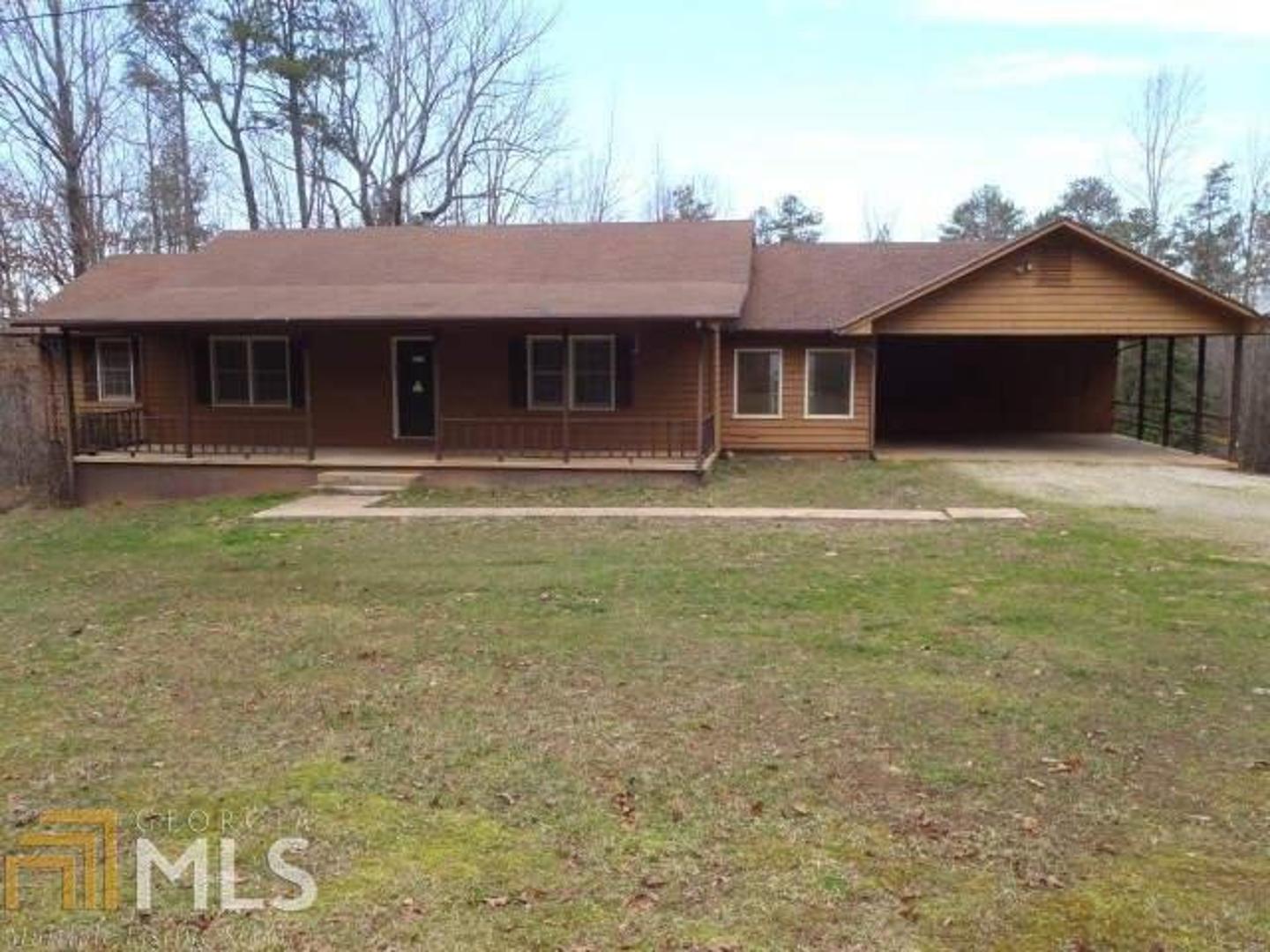 371 C C Jordan Road Lula, GA 30554 - Photo 1 of 1 a front view of a house with a garden