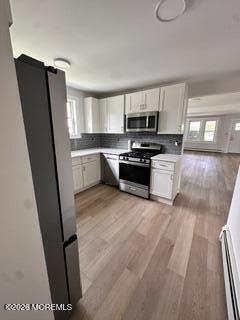 1721 River Road Belmar, NJ 07719 - Photo 13 of 14 a kitchen with stainless steel appliances a refrigerator sink and microwave