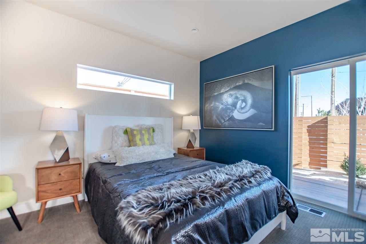 1404 Tonopah Street Reno, NV 89509 - Photo 8 of 19 a bedroom with a large bed and a window