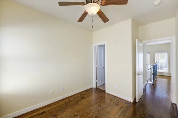 a view of a room with wooden floor