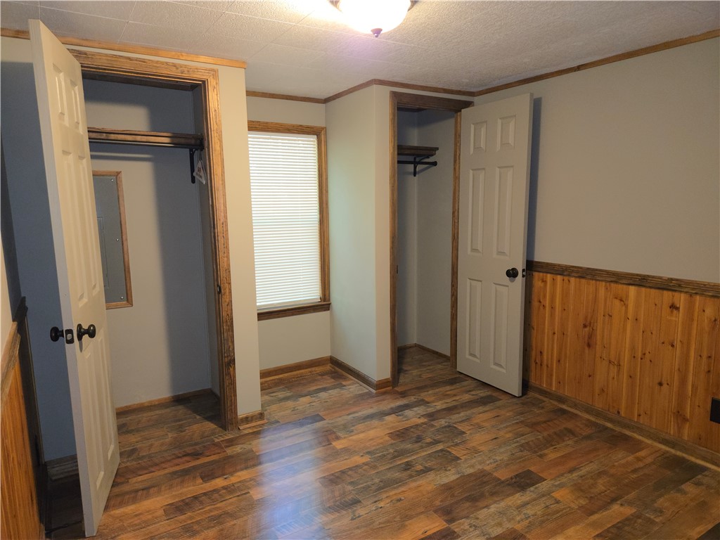 238 Forest Lane Starr, SC 29684 - Photo 7 of 11 Warm wood accents complement the natural light in this inviting bedroom.