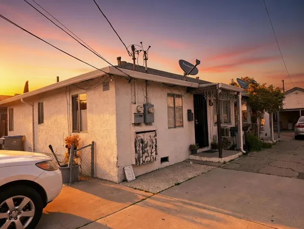 a view of a car park in front of house