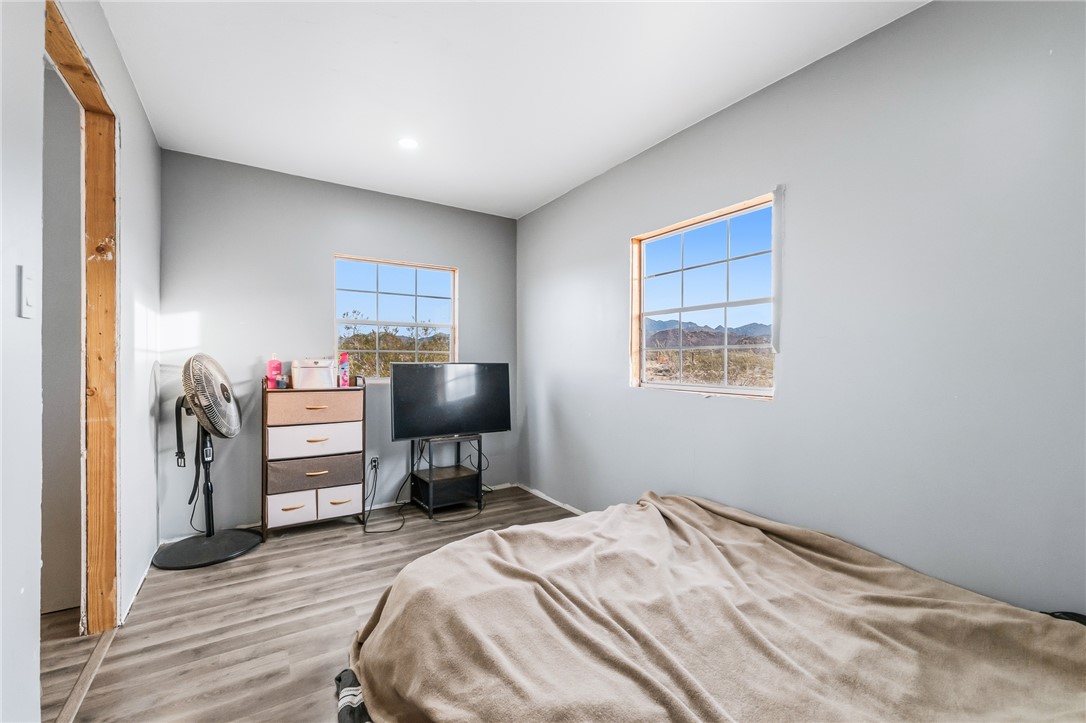 12241 South Robles Road Yucca, AZ 86438 - Photo 15 of 43 Bedroom with wood finished floors