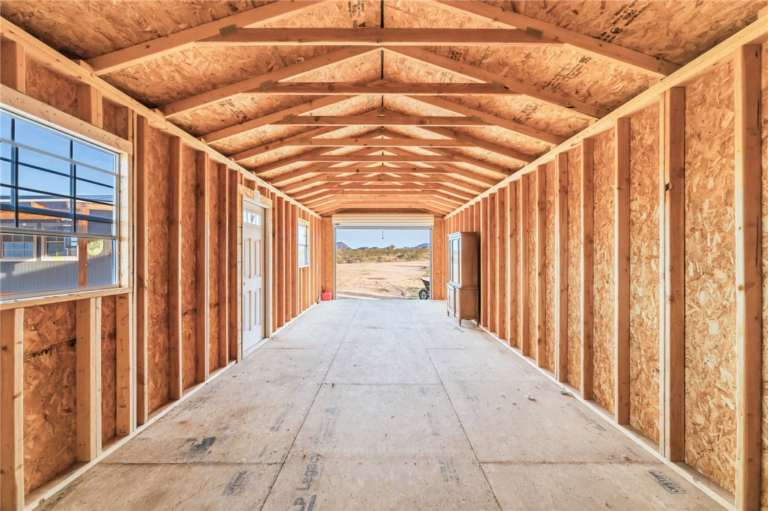 12241 South Robles Road Yucca, AZ 86438 - Photo 17 of 43 Storage area featuring an exterior structure