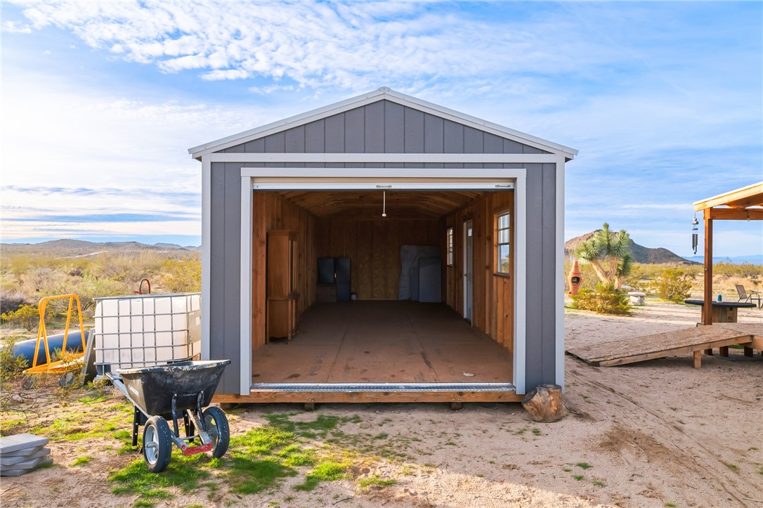 12241 South Robles Road Yucca, AZ 86438 - Photo 19 of 43 View of outbuilding with a mountain view