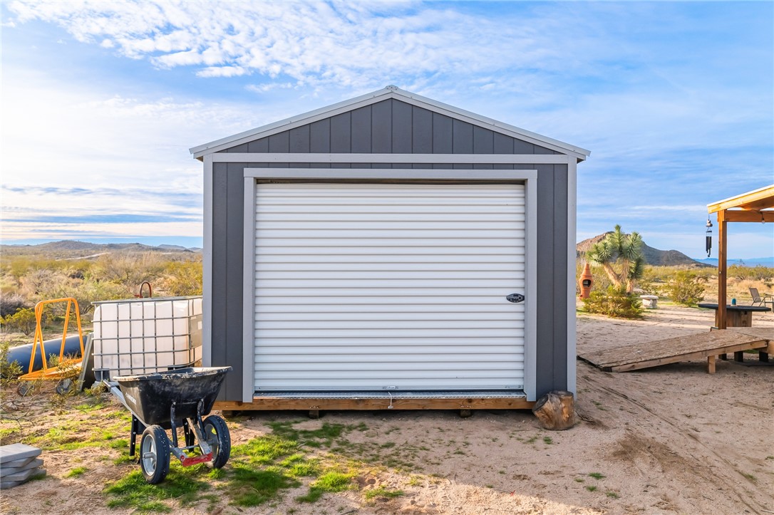 12241 South Robles Road Yucca, AZ 86438 - Photo 20 of 43 Garage with a mountain view