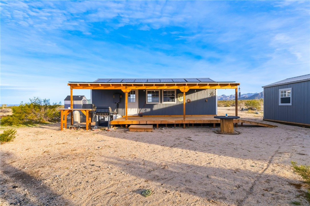 12241 South Robles Road Yucca, AZ 86438 - Photo 29 of 43 View of outdoor structure featuring solar panels