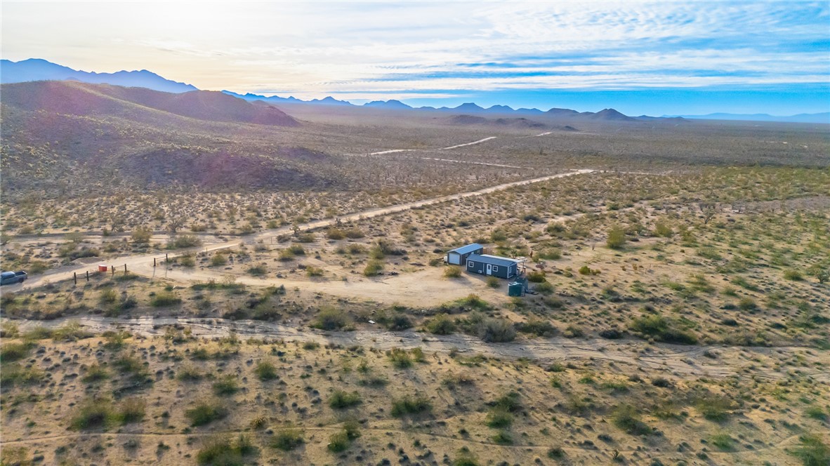 12241 South Robles Road Yucca, AZ 86438 - Photo 35 of 43 Overview of rural landscape featuring a mountain backdrop and a desert landscape
