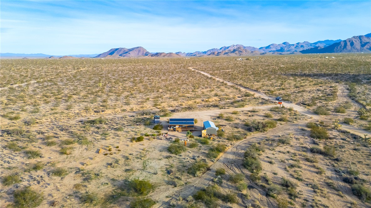 12241 South Robles Road Yucca, AZ 86438 - Photo 38 of 43 Overview of rural landscape with a mountain backdrop and a desert landscape