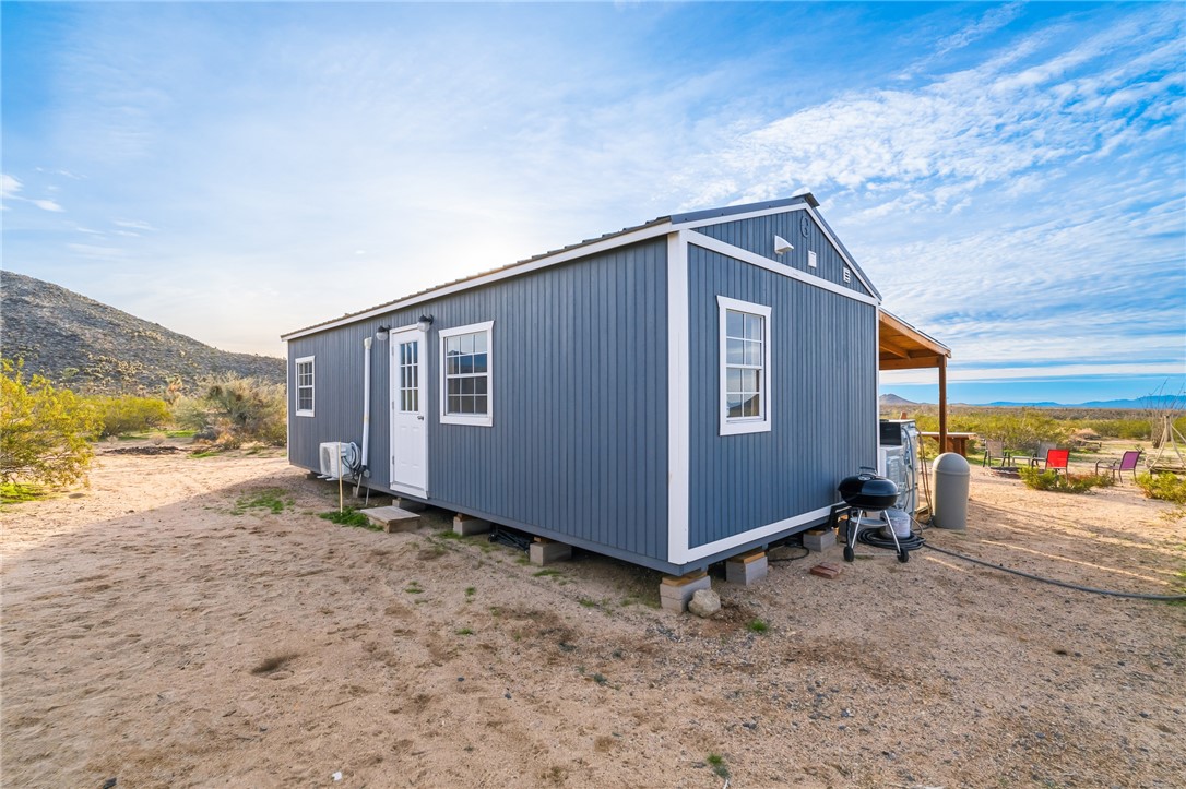 12241 South Robles Road Yucca, AZ 86438 - Photo 5 of 43 View of outbuilding featuring a mountain view