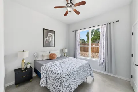 a bedroom with a bed and window