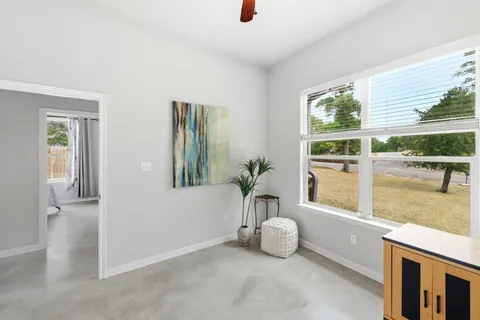 a view of an empty room with a window