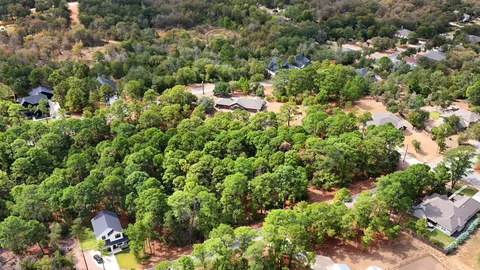 a view of a house with a tree