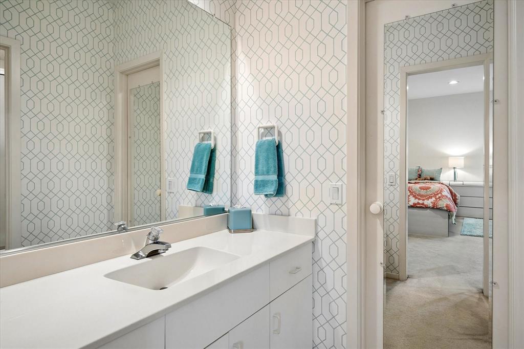 6419 Laurel Valley Road Dallas, TX 75248 - Photo 23 of 34 a bathroom with a sink and a mirror