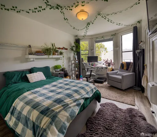 a bedroom with a bed and ceiling fan