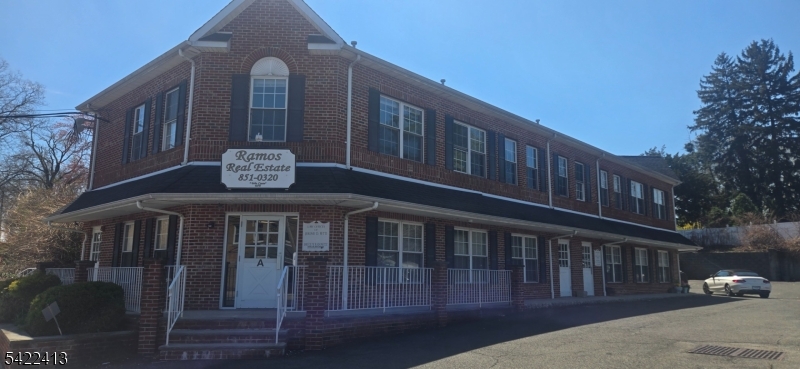 a front view of building with street