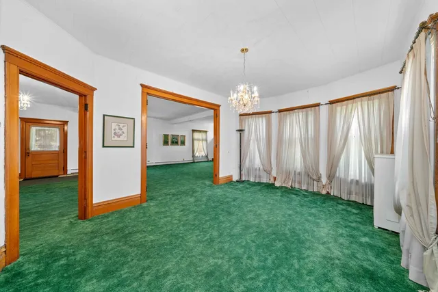 a view of an entryway with wooden floor and windows