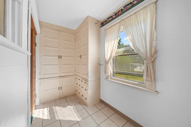 a view of front door with wooden floor
