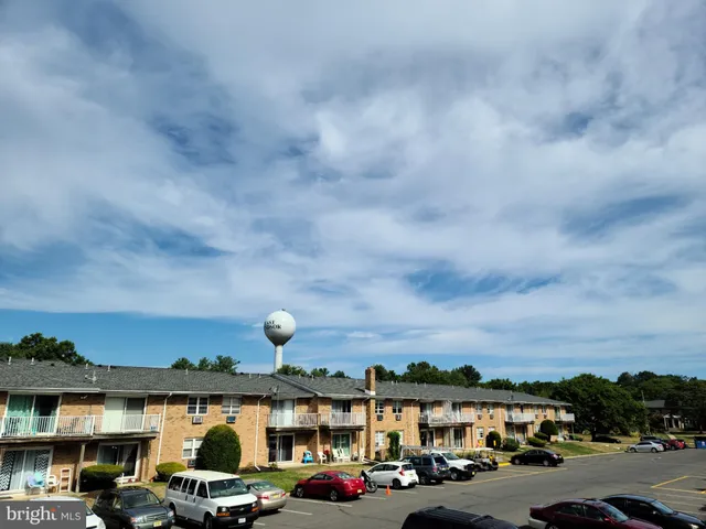 a view of cars parked in front of a building