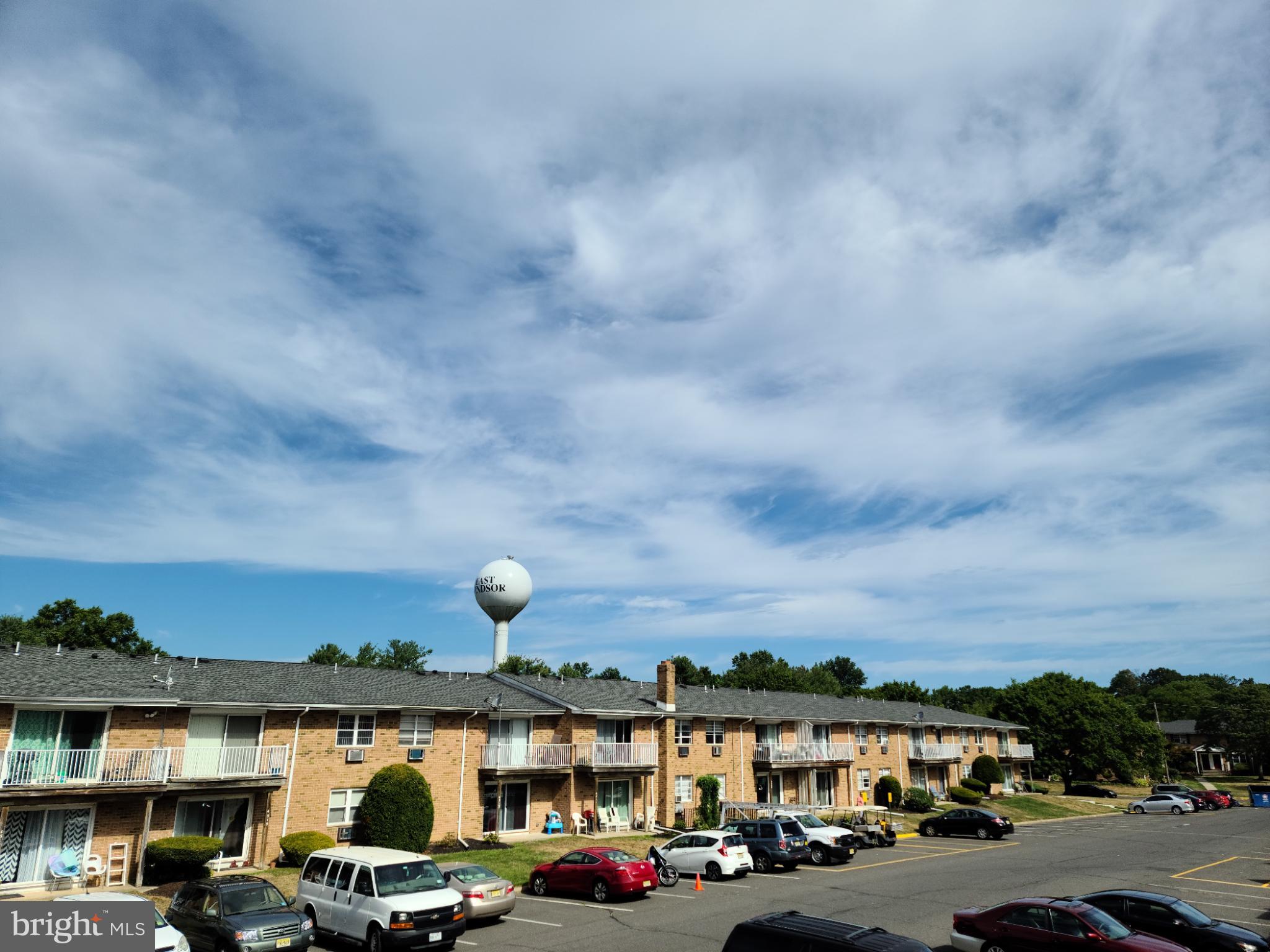 47 Garden View Terrace, Unit 4 East Windsor, NJ 08520 - Photo 11 of 12 a view of cars parked in front of a building