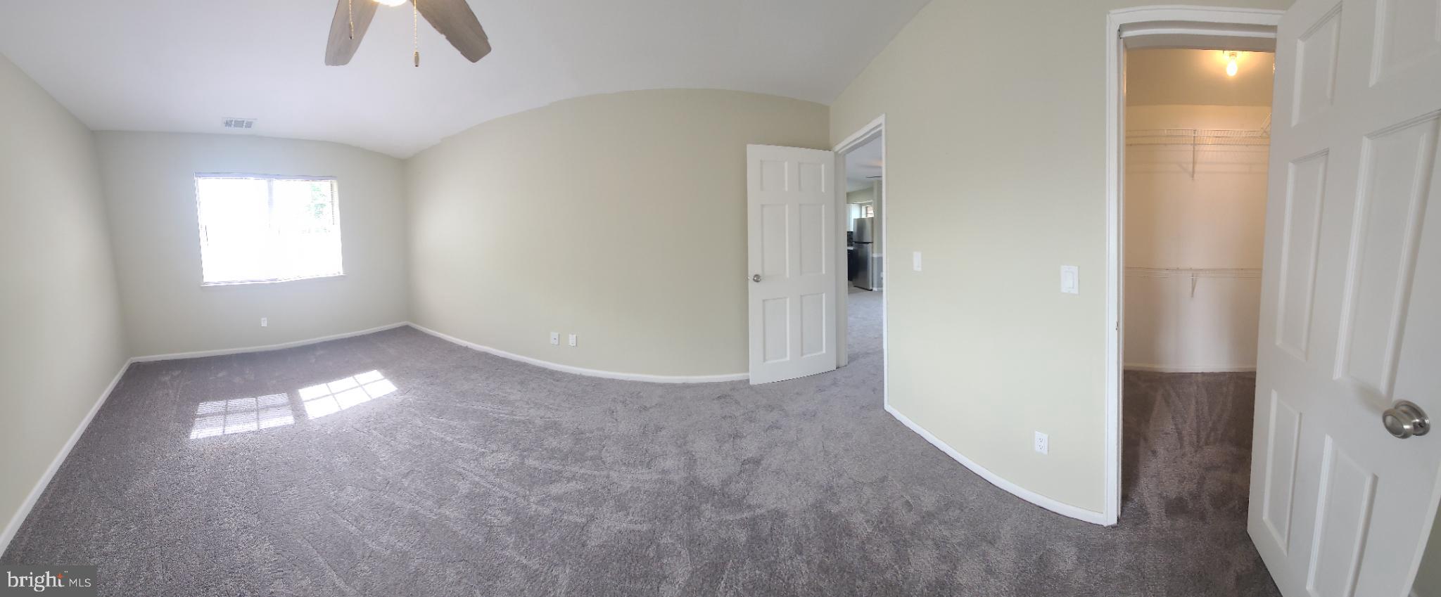 47 Garden View Terrace, Unit 4 East Windsor, NJ 08520 - Photo 6 of 12 a view of empty room with window and ceiling fan