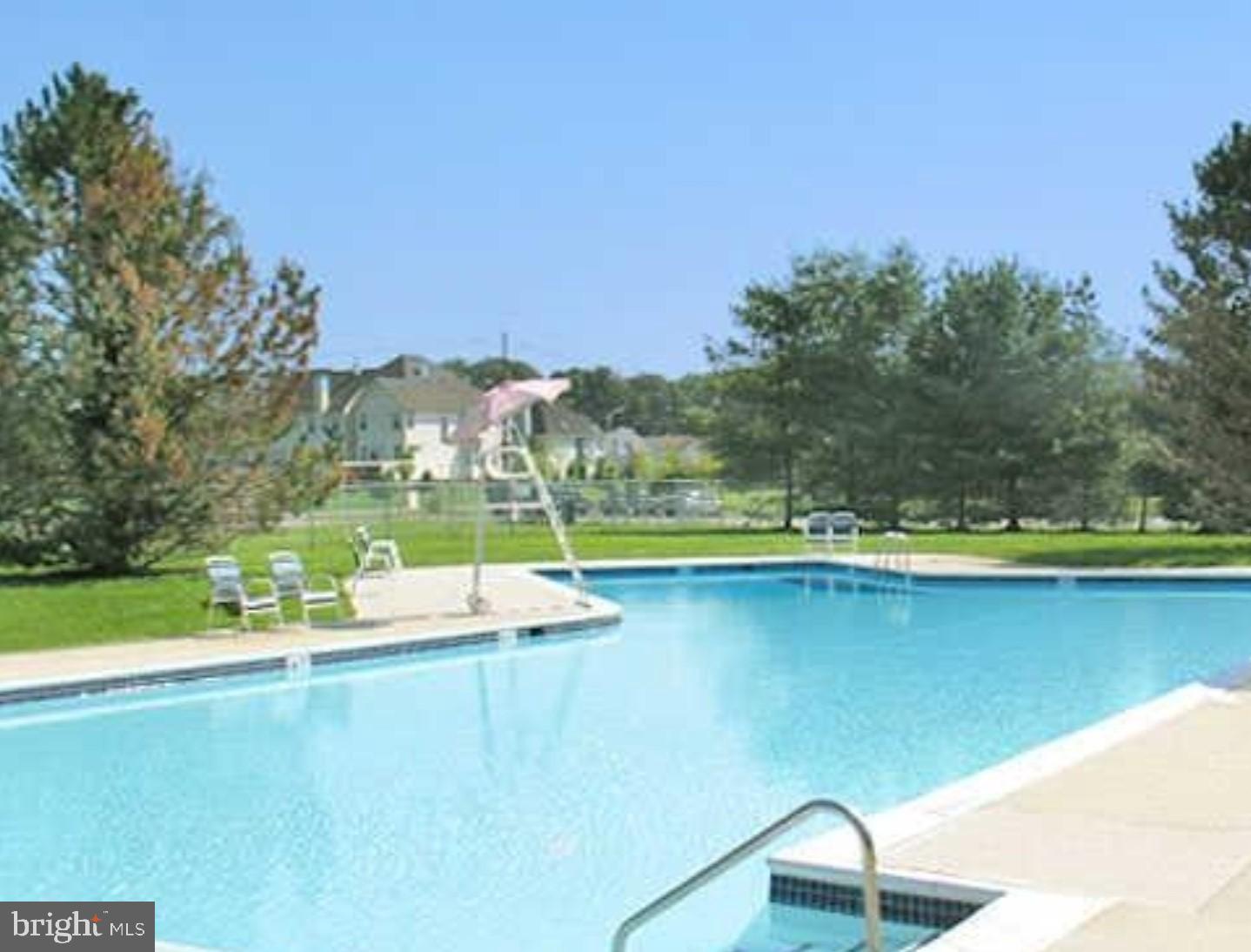 47 Garden View Terrace, Unit 4 East Windsor, NJ 08520 - Photo 10 of 12 a view of a lake with a mountain in the background