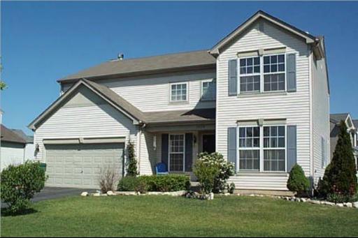 25774 West Prairieview Road Round Lake, IL 60073 - Photo 1 of 1 a front view of a house with a yard and garage