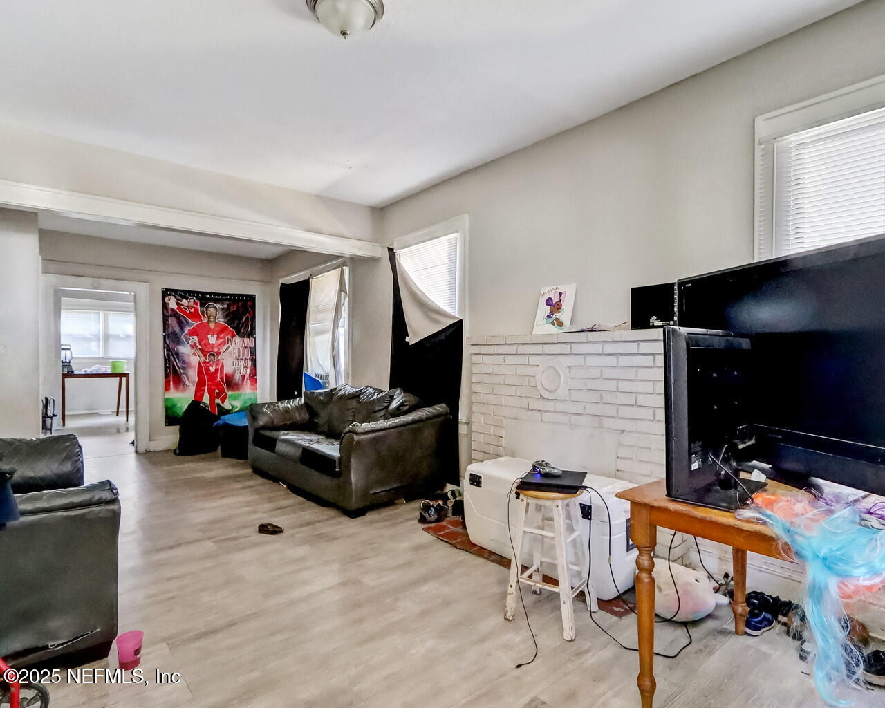 446 West 26th Street Jacksonville, FL 32206 - Photo 7 of 19 a living room with furniture and a flat screen tv