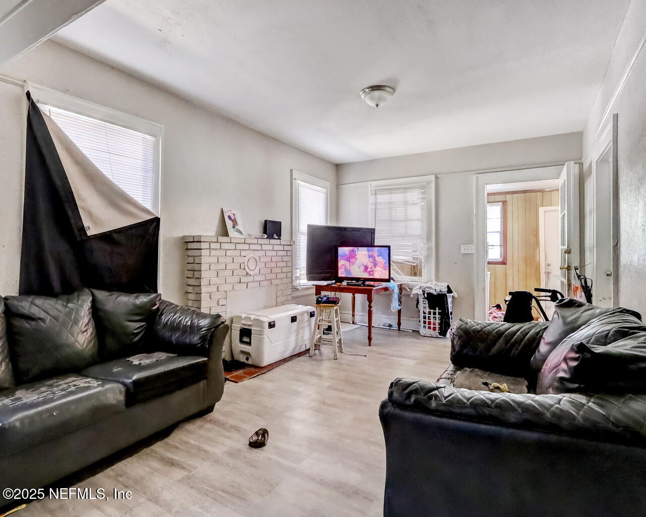 446 West 26th Street Jacksonville, FL 32206 - Photo 8 of 19 a living room with furniture and a flat screen tv