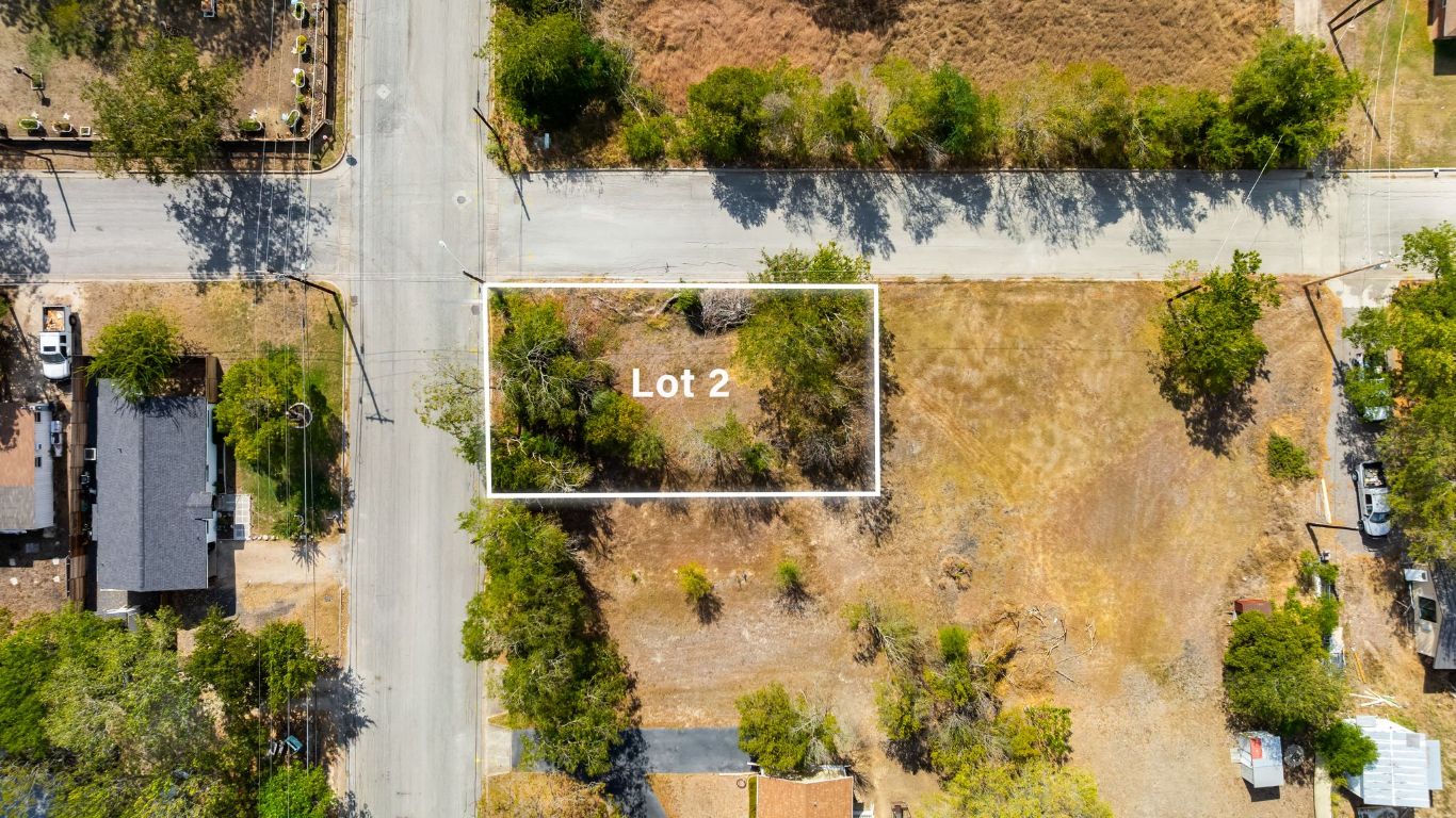901 North Blanco Street Lockhart, TX 78644 - Photo 2 of 6 an aerial view of a residential houses with swimming pool and outdoor space