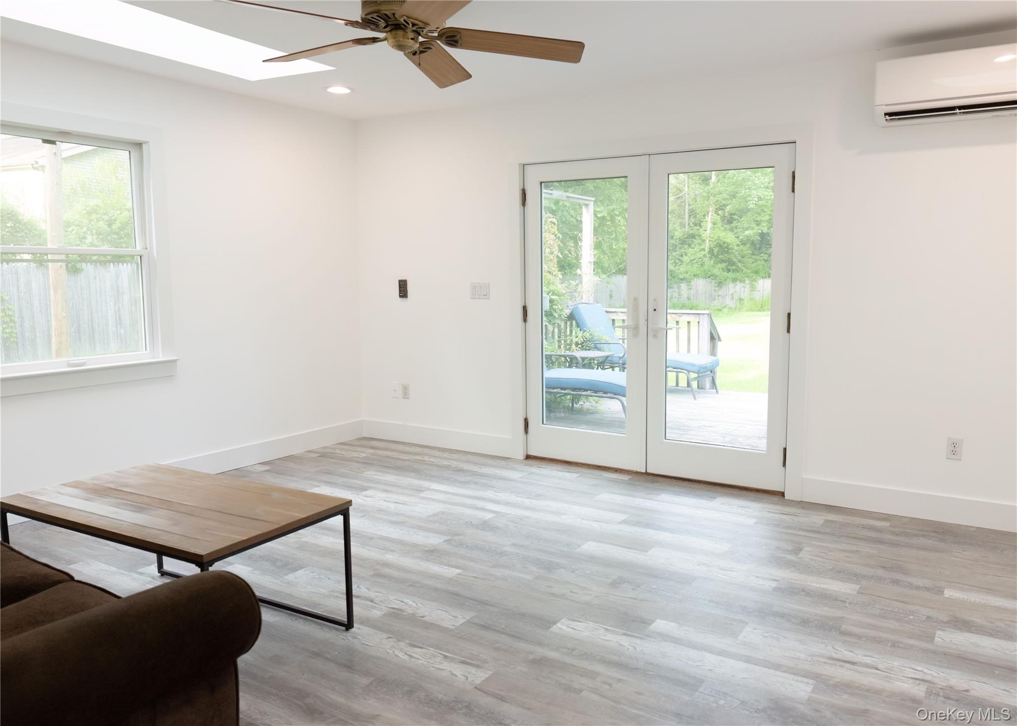 23 Lucille Road Carmel, NY 10512 - Photo 26 of 44 an empty room with windows and ceiling fan