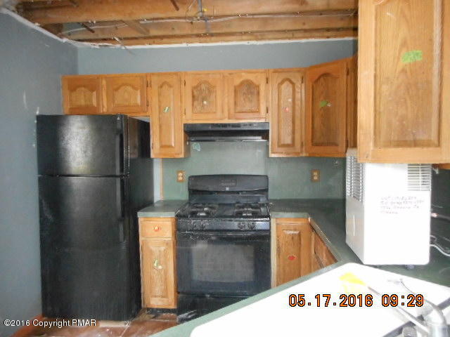 5522 Granite Road Long Pond, PA 18334 - Photo 3 of 19 a kitchen with stainless steel appliances granite countertop a refrigerator and a stove
