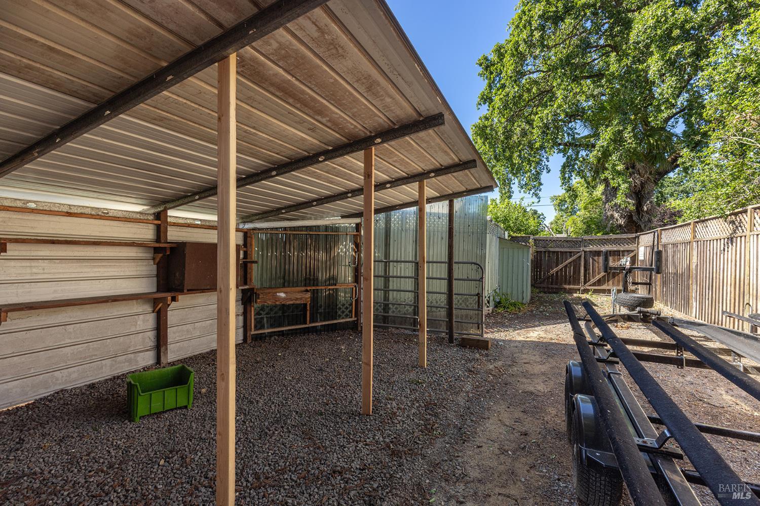 2236 West Hearn Avenue Santa Rosa, CA 95407 - Photo 49 of 56 a view of a backyard with a patio and wooden fence