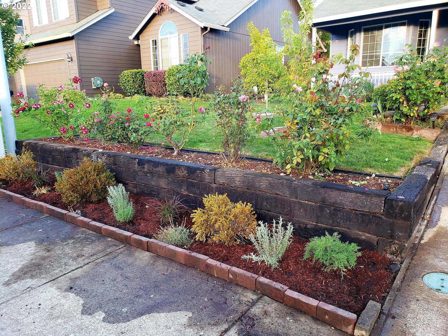 1254 Crystal Lane Lafayette, OR 97127 - Photo 3 of 25 a front view of a house with a yard and a garden