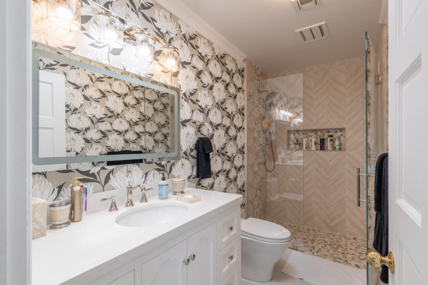 1043 Broncho Road Pebble Beach, CA 93953 - Photo 20 of 21 a bathroom with a sink vanity mirror and toilet