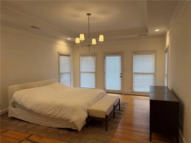 a room with a wooden floor and a sink