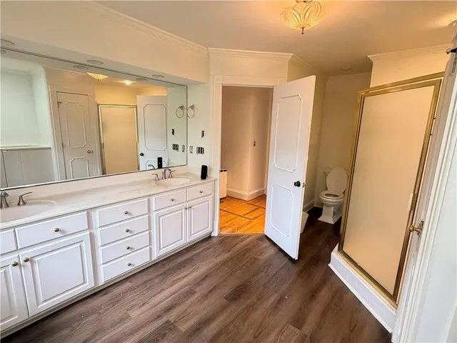 a room with a table chairs and wooden floor