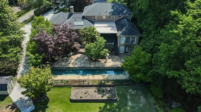 an aerial view of a house with garden space lake view