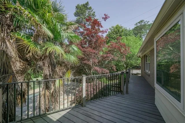 a view of balcony with wooden floor