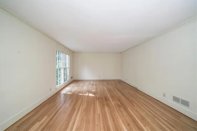 a view of an empty room and window