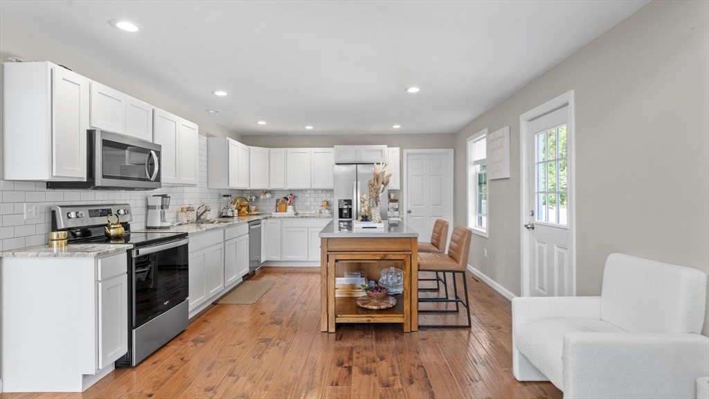 96 Town Farm Road Warren, MA 01083 - Photo 5 of 39 a kitchen with white cabinets and stainless steel appliances