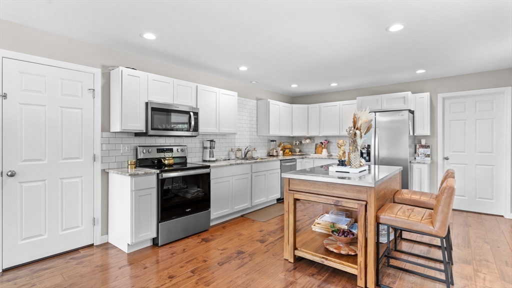 96 Town Farm Road Warren, MA 01083 - Photo 8 of 39 a kitchen with a sink stainless steel appliances and white cabinets