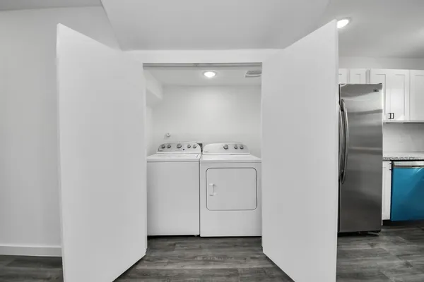 a view of kitchen with sink and wooden floor