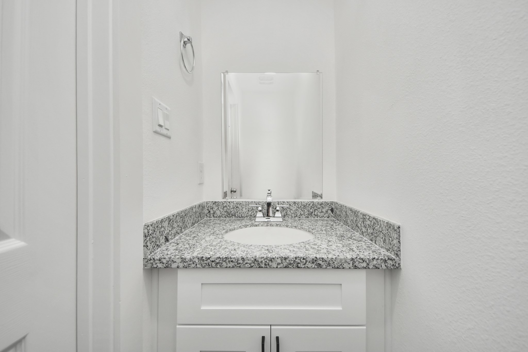 2310 Wavell Street, Unit B Houston, TX 77088 - Photo 14 of 31 a bathroom with a granite countertop sink and a mirror